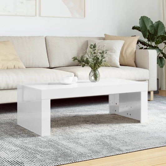 Konferenčný stolík lesklý biely 102x50x36 cm kompozitné drevo